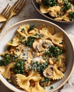 One-Pot Mushroom and White Bean Pasta dish garnished with herbs