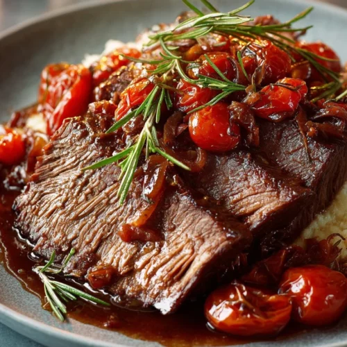 Delicious slow cooker beef brisket ready to serve with herbs and spices.