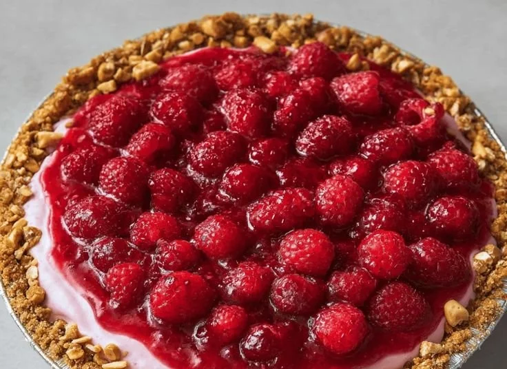 No-bake raspberry pretzel pie with a crunchy crust and fresh raspberry topping