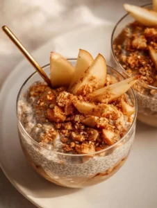 Delicious Apple Crumble Chia Pudding topped with apples and crumble