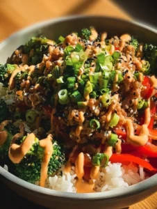 Bang Bang Ground Turkey Rice Bowls topped with vegetables and sauce