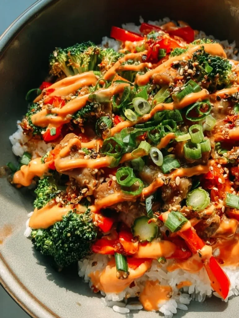 Bang Bang ground turkey rice bowls with colorful vegetables and sauce