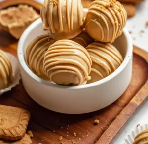 Delicious no-bake Biscoff truffles coated in chocolate.