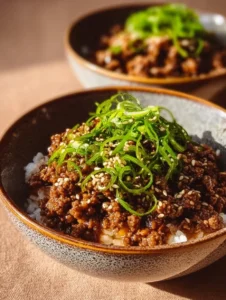 Ground Beef Hot Honey Bowl with veggies and spices in a colorful dish